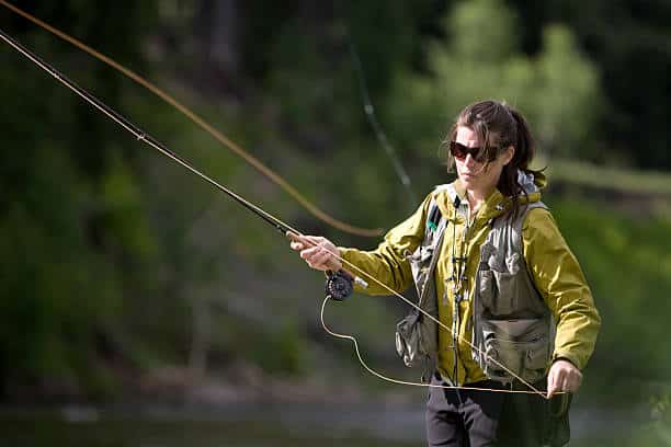 A woman fly fishing in Montana