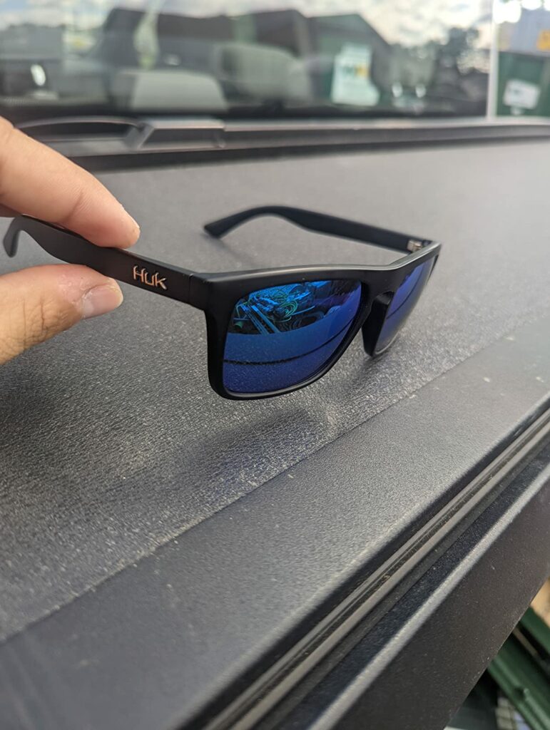 This photo from our of best fishing sunglasses guide shows Huk Polarized Sunglasses side view. 